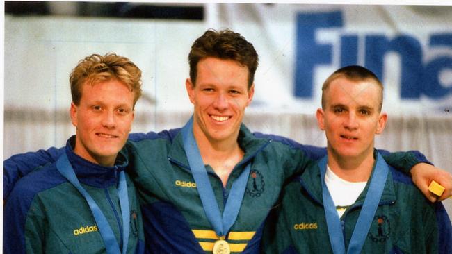 Perkins alongside fellow swimming greats Daniel Kowalski (left) and Glen Housman in Canada in 1994.