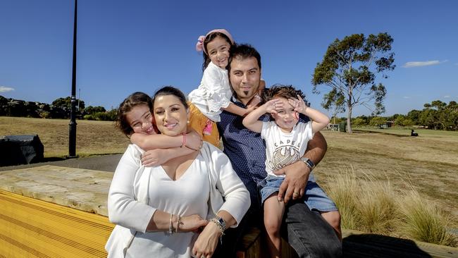 Vanessa and Nathan Lania with their children yesterday. Picture: Luis Enrique Ascui