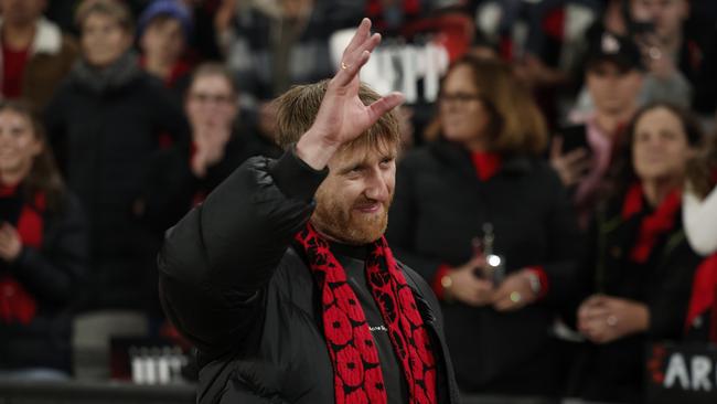 MELBOURNE, AUSTRALIA – AUGUST 16: Dyson Heppell of the Bombers gestures to fans during the round 23 AFL match between Essendon Bombers and Sydney Swans at Marvel Stadium, on August 16, 2024, in Melbourne, Australia. (Photo by Daniel Pockett/Getty Images)