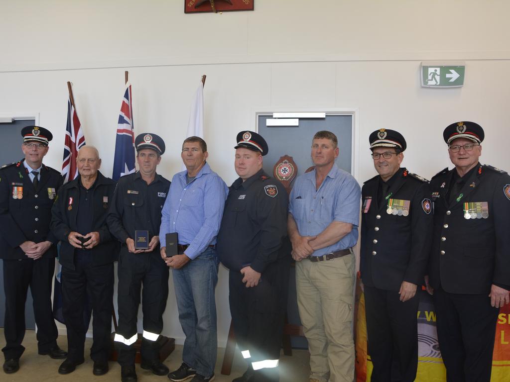 A number of Allora's rural and urban firefighters were awarded during Rural Fire Service Week at the recommissioned Allora facility on Saturday, August 3rd. (From left) RFSQ deputy chief officer Matthew Inwood, Frederick McCann, Andrew Peterson, Matthew Heslin, Ross Williams, Geoffrey Pitstock, QFD commissioner Steve Smith and FRS assistant commissioner David Hermann. Photo: Jessica Klein