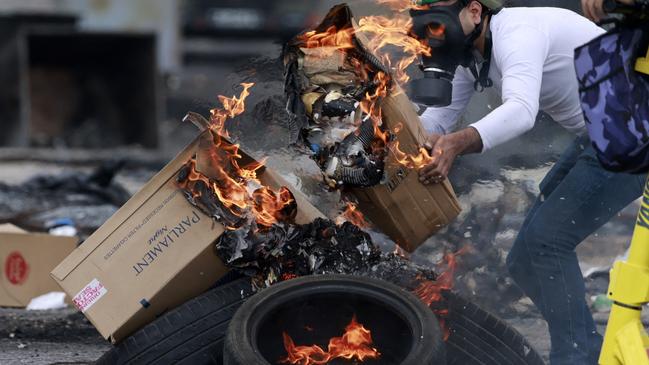 Palestinians burn tyres as they clash with Israeli forces at the northern entrance of the West Bank city of Ramallah near the Israeli settlement of Beit El on Friday. Picture: Zain Jaafar/AFP