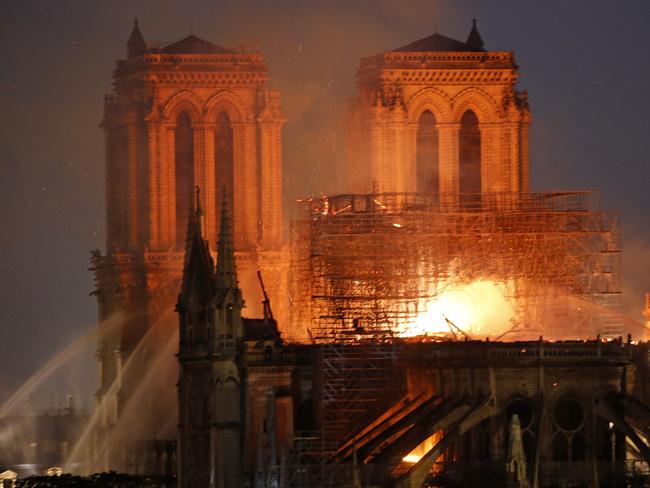 Flames and smoke are seen billowing from the roof at Notre-Dame Cathedral on April 15, 2019 in Paris, France. (Photo by Chesnot/Getty Images)