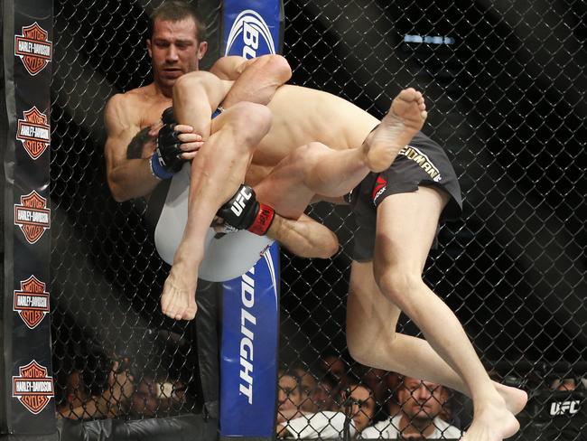 Luke Rockhold and Chris Weidman grapple.