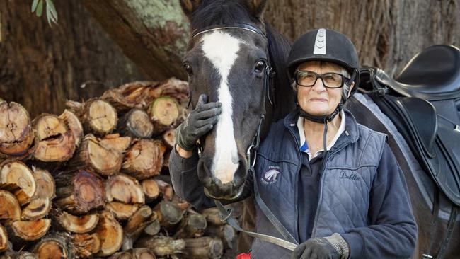 Elaine Lobb is from Romsey, Victoria, has been riding horses since she was four-years old. Now in her 80s, and she has turned her hand to the skill of dressage riding. She is pictured with her horse, Holly. Picture: Zoe Phillips