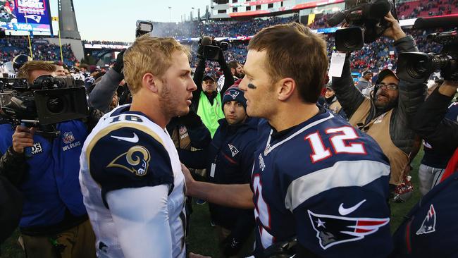 (FILES) In this file photo Jared Goff #16 (L) of the Los Angeles Rams greets Tom Brady #12 (R) of the New England Patriots after the New England Patriots defeated the Los Angeles Rams 26-10 at Gillette Stadium on December 4, 2016 in Foxboro, Massachusetts. - The New Englans Patriots will play against the Los Angeles Rams for Super Bowl LII (52). The game is scheduled to be played on February 3, 2019 at Mercedes-Benz Stadium in Atlanta, Georgia. (Photo by Adam Glanzman / GETTY IMAGES NORTH AMERICA / AFP)