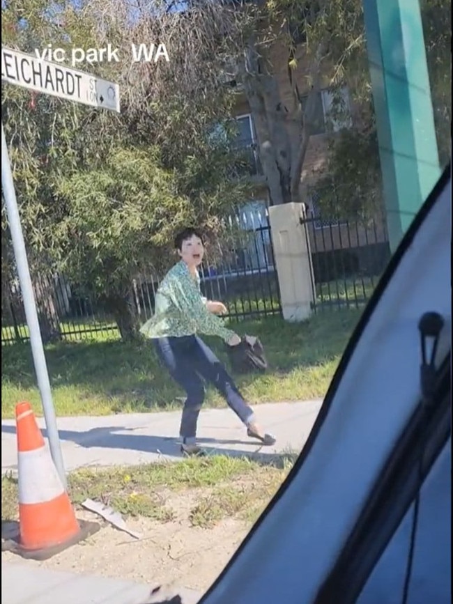 The woman pretended to throw her bag at the car. Picture: TikTok