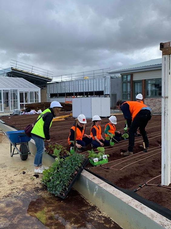 Students from Burwood’s Roberts McCubbin Primary School joined the team to plant the first tomato and eggplant seedlings.