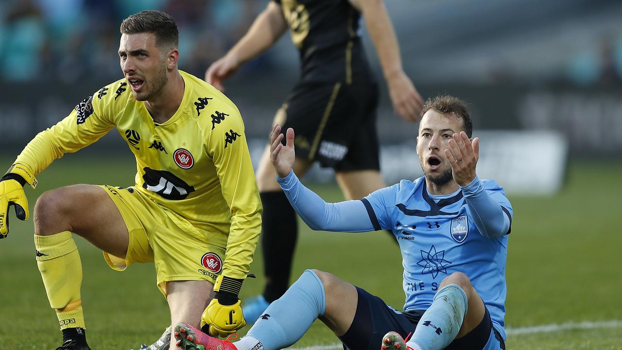 Adam Le Fondre of Sydney FC reacts after a clash with Daniel Margush of the Wanderers.