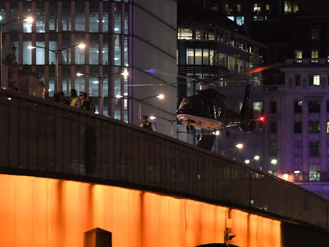 An emergency response helicopter lands on London Bridge. Picture: AFP