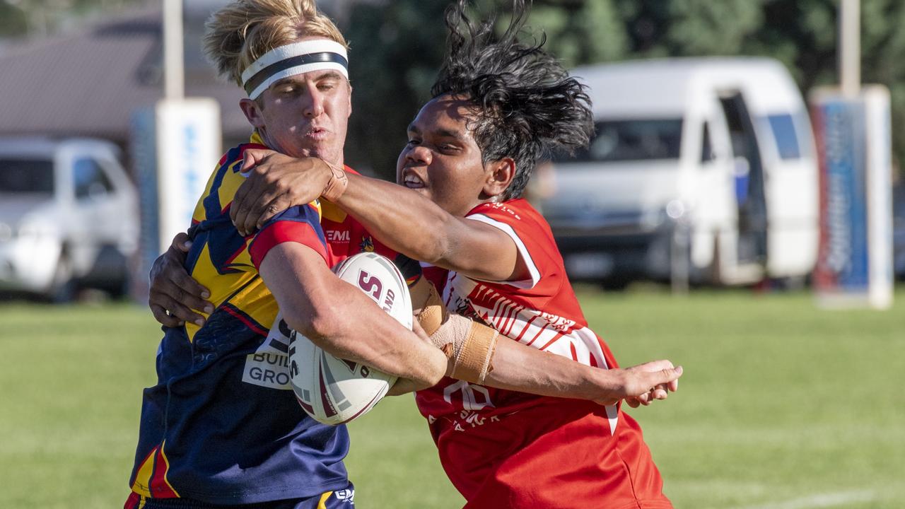 Riley Wockner, Mustangs is tackled. Picture: Nev Madsen.