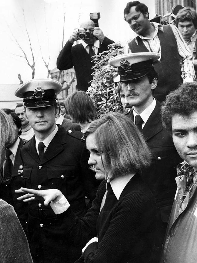 1977: Tram conductress Barbara Biggs who refused to join the union is escorted to work by Victorian Police. File picture