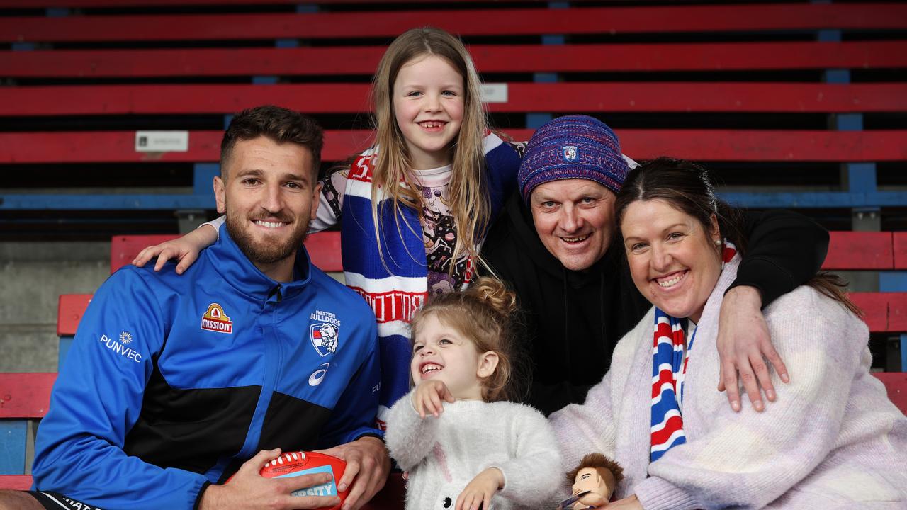 Bulldogs player Marcus Bontempelli with three-year-old liver transplant recipient Maia Govan and her family, parents Richard and Tara and sister Luna. Picture: David Caird