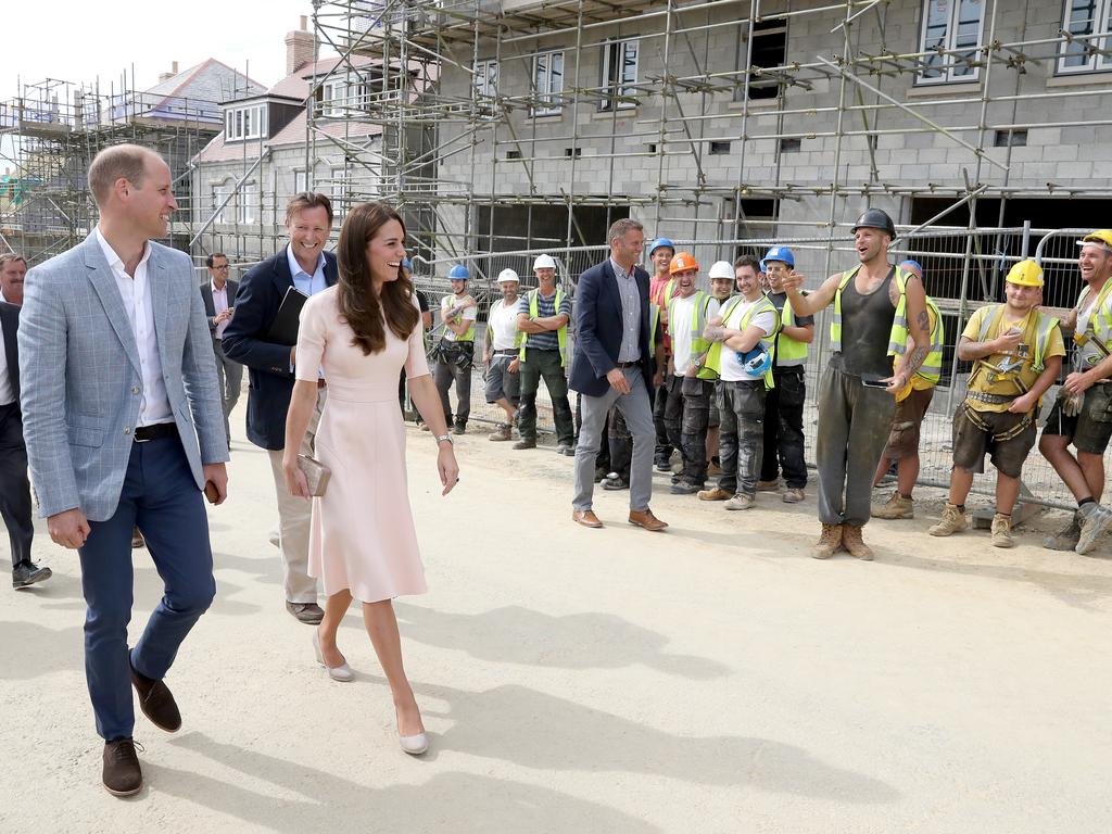 Prince William, Duke of Cambridge and Catherine, Duchess of Cambridge share a joke with construction workers as they visit Nansledan, a 218-hectare site that will provide future business and housing for the local area on September 1, 2016 in Newquay, United Kingdom. Picture: Getty