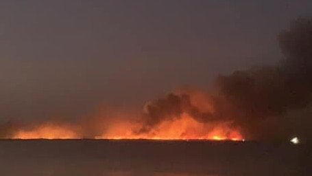 The fire at Noosa North Shore looking north from Noosa Beach. Picture: Black Mountain Rural Fire Brigade