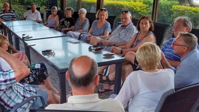 Eddy Sarroff (far right) talking to Southport residents about their protest against a second Gold Coast casino.