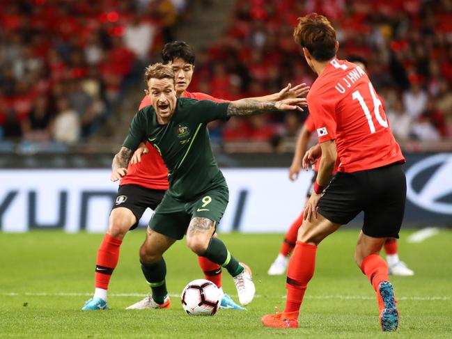 BUSAN, SOUTH KOREA - JUNE 07: Adam Taggart (C) of Australia controls the ball under pressure of Ju Sejong (L) and Hwang Uijo (R) of South Korea during the international friendly match between South Korea and Australia at Busan Asiad Main Stadium on June 7, 2019 in Busan, South Korea. (Photo by Chung Sung-Jun/Getty Images)