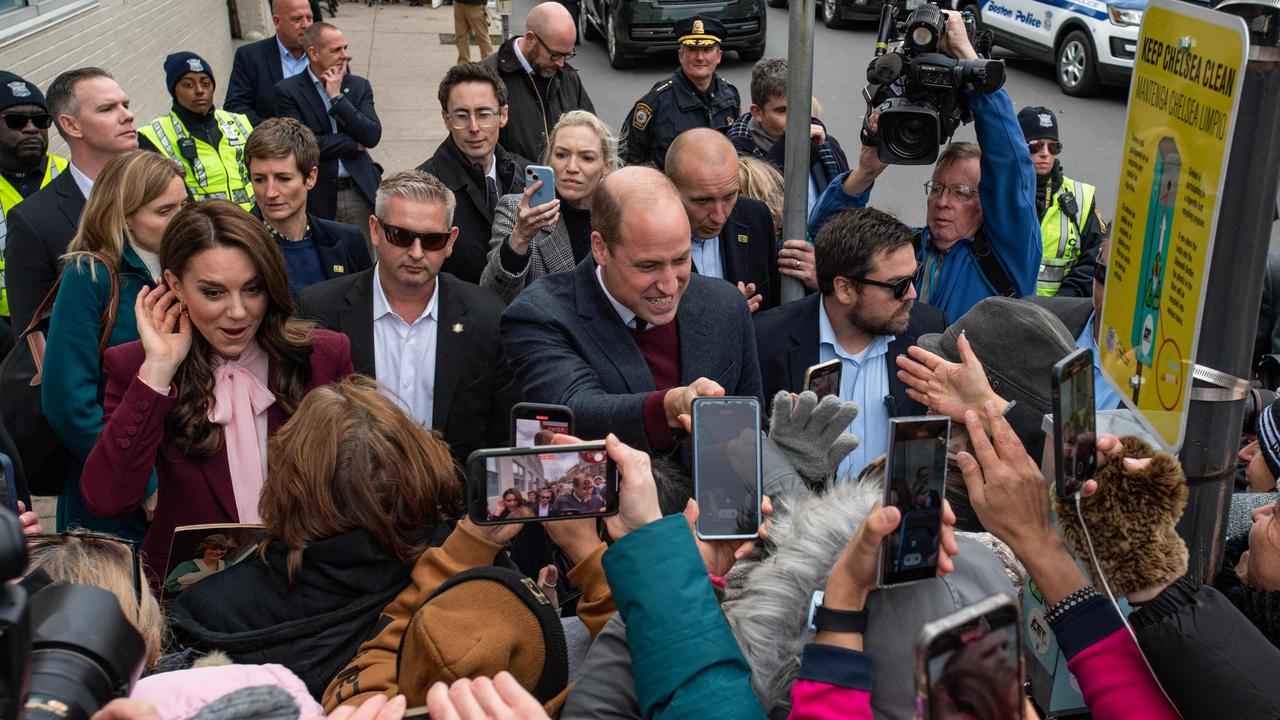 Neither the royal couple or their fans showed any sign of the converversies brewing within the monarchy. Picture: AFP