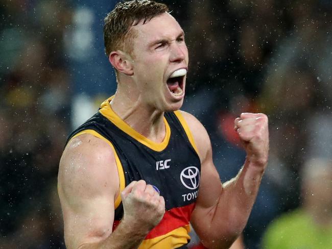 Tom Lynch celebrates a goal … now the talismanic forward has committed his future to Adelaide for another three years. Picture: Kelly Barnes/AAP