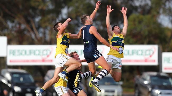 South Adelaide v Eagles have eyes only for the ball at Noarlunga Oval. Picture: Tait Schmaal.