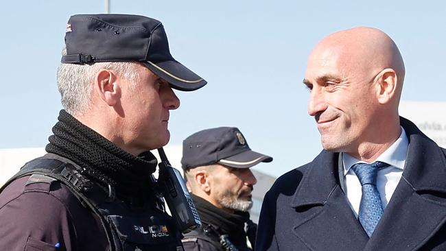 Luis Rubiales with police officers as he leaves court. Picture: AFP.