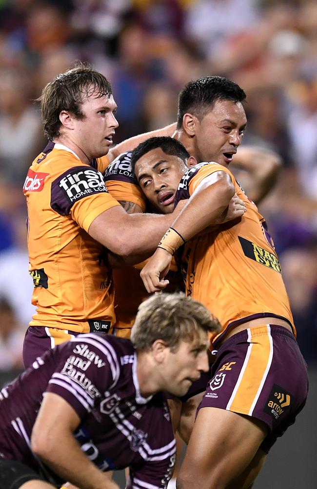 Jake Turpin and Alex Glenn give Anthony Milford some love after he scored a try. Picture: Albert Perez/Getty Images