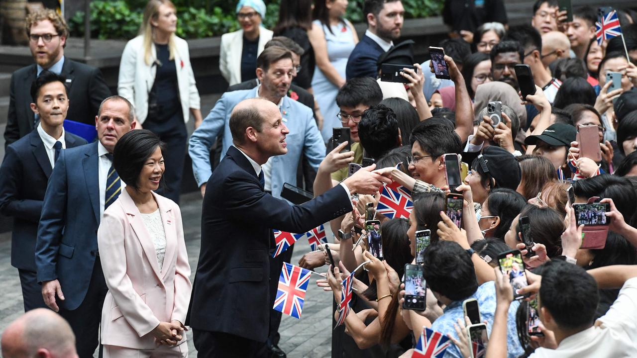 Prince William is greeted like the fifth Beatle upon arrival at Jewel Changi Airport in Singapore. Picture: ROSLAN RAHMAN / AFP