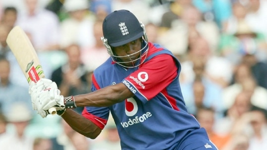 England's Dimitri Mascarenhas hits a six from a ball from India's Yuvraj Singh.