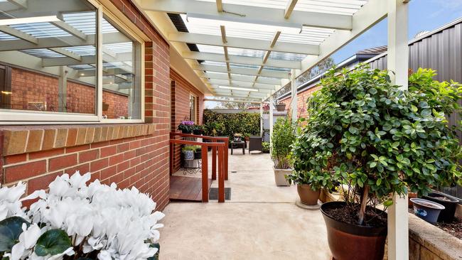 The covered outdoor entertainment area is a sheltered spot.