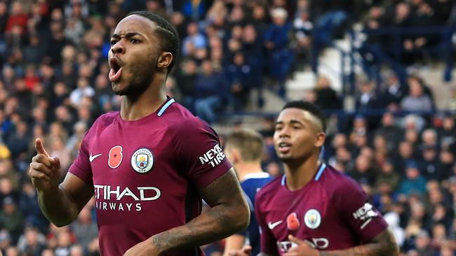 Manchester City's English midfielder Raheem Sterling celebrates scoring.