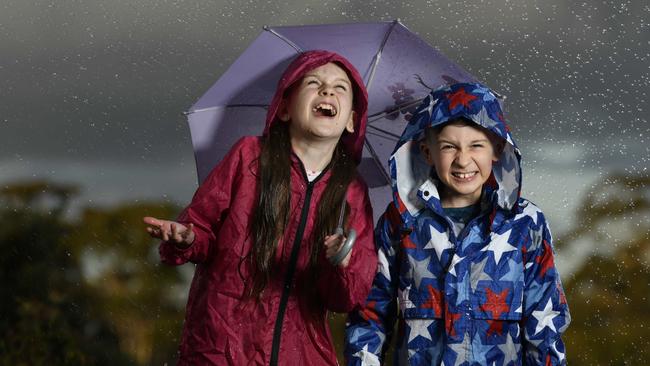 Siblings Edith, 11, and Angus Cullen, 9, are looking forward to the rain. Picture: Naomi Jellicoe