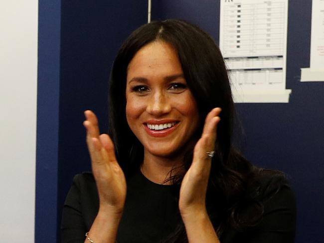 LONDON, ENGLAND - JUNE 29: Manager Aaron Boone of the New York Yankees presents a gift for Archie to Prince Harry, Duke of Sussex and Meghan, Duchess of Sussex before their game against the Boston Red Sox at London Stadium on June 29, 2019 in London, England. The game is in support of the Invictus Games Foundation. (Photo by Peter Nicholls - WPA Pool/Getty Images)