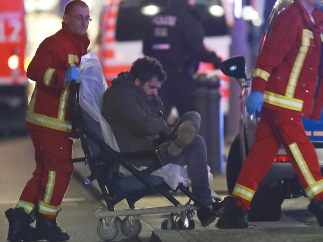 An injured man is pushed to an ambulance at the site of an accident with a truck at a Christmas market on Breitscheidplatz square near the fashionable Kurfuerstendamm avenue in the west of Berlin, Germany on December 19, 2016. Picture: Reuters