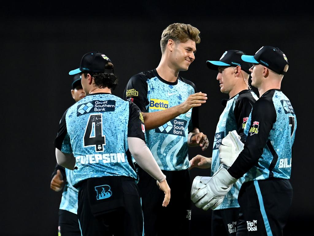 Spencer Johnson (centre) celebrates a wicket with his Brisbane Heat teammates. Picture: Albert Perez/Getty Images