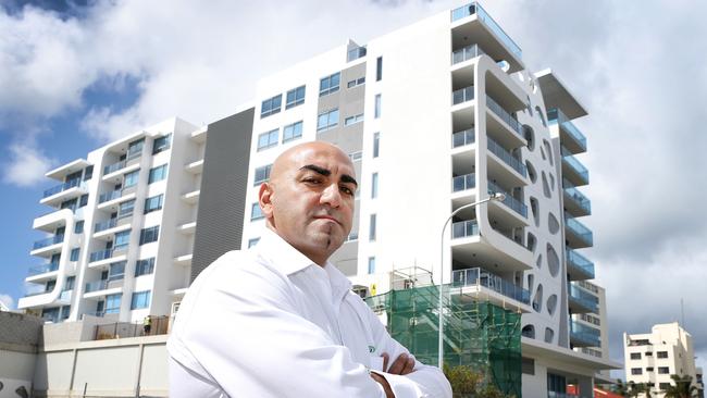 Superseal company owner John Abouslaibi outside the Raptis Sapphire building in Labrador in 2014. He was seeking money owned to his company from work on the building. Picture: Glenn Hampson