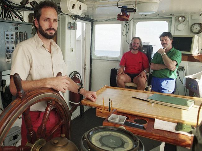 In control ... Tommy Thompson, left, stands at the helm of the Arctic Explorer as Bob Evans, centre, and Barry Schatz look on. Source: AP