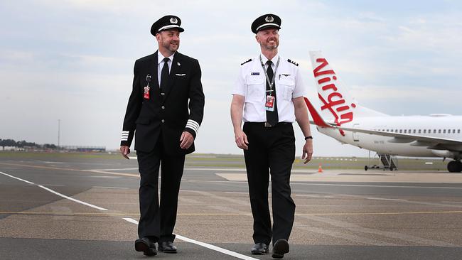 Pilots Ricketts and First Officer Craig Chapman are looking forward to doing some more flying after easing of NSW-VIC border restrictions. Picture: Jane Dempster