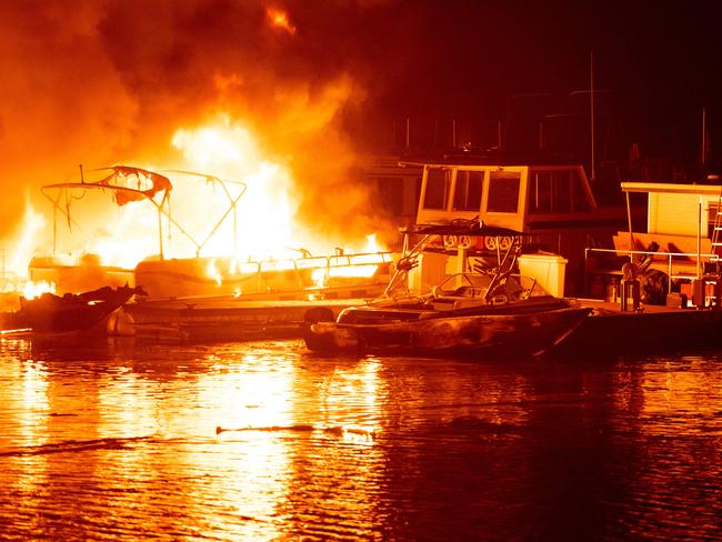 Docked boats burn on Lake Berryessa during the LNU Lightning Complex fire in Napa, California. Picture: AFP