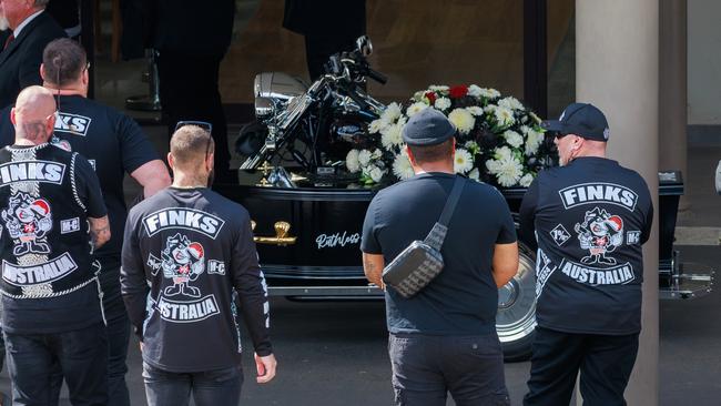 Finks bikies outside the funeral service for their fallen associate.