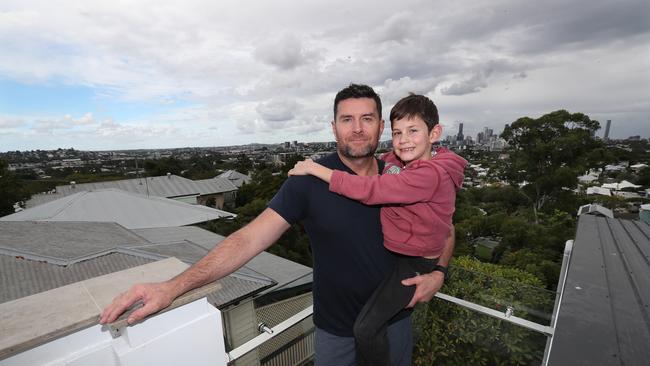 Bill McDonald with son James, 8, at their home in Windsor. Picture: Annette Dew