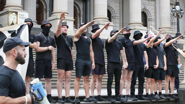 Protest groups face off in front of the Victorian parliament where UK far right activist Kellie-Jay Keen spoke. Far right wing group does Nazi salutes on the steps of parliament. Picture: NCA NewsWire / David Crosling