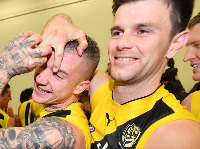 Dustin Martin of the Tigers celebrates in the change room with team mates after the Round 15 AFL match between the Port Adelaide Power and the Richmond Tigers at Adelaide Oval in Adelaide, Saturday, July 1, 2017. (AAP Image/David Mariuz) NO ARCHIVING, EDITORIAL USE ONLY