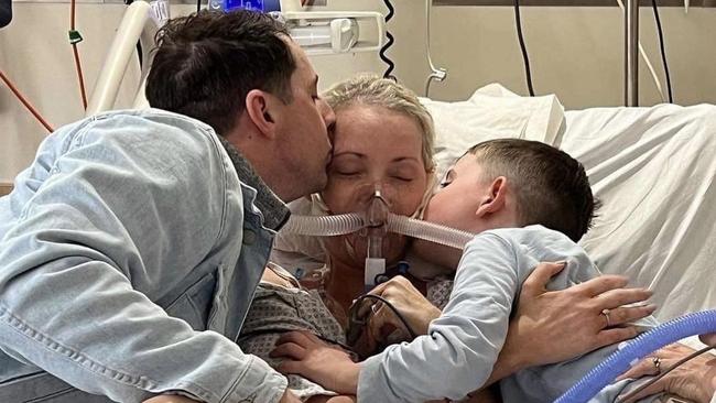 Nicole Cooper with her husband and son in hospital.