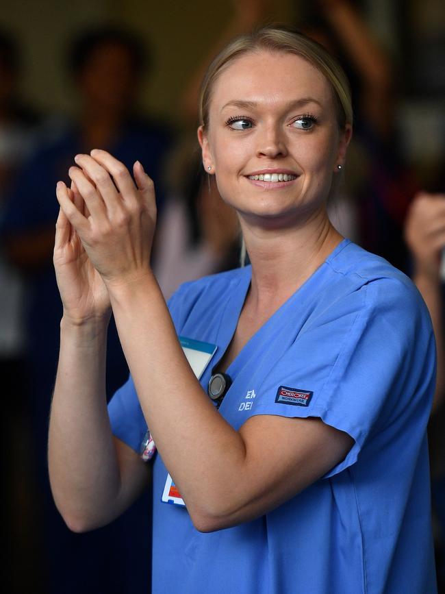 An NHS worker participates in last week’s national “clap for carers”. Picture: AFP