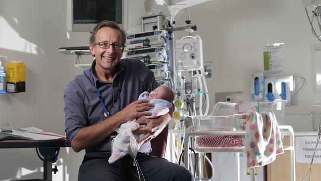 Professor Peter Dargaville in the Neonatal ward at the Royal Hobart Hospital holding premature baby, Aria-Rose Strong Picture: LUKE BOWDEN