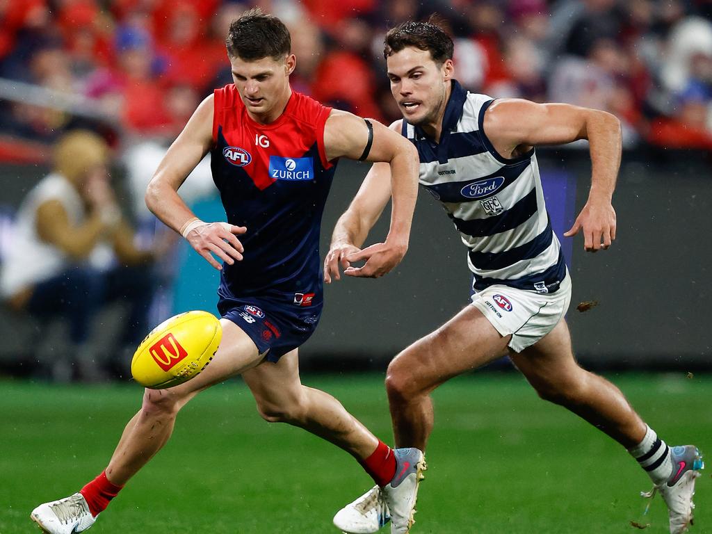 GEELONG, AUSTRALIA - JUNE 22: Judd McVee of the Demons and Jack Bowes of the Cats in action during the 2023 AFL Round 15 match between the Geelong Cats and the Melbourne Demons at GMHBA Stadium on June 22, 2023 in Geelong, Australia. (Photo by Michael Willson/AFL Photos)