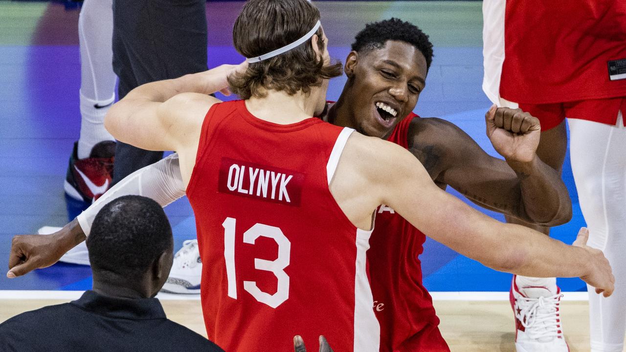 Canadian players celebrate after winning the FIBA ​​Basketball World Cup third place game between the United States and Canada at the Mall of Asia Arena on September 10, 2023 in Manila, Philippines. (Photo by Ezra Acayan/Getty Images)