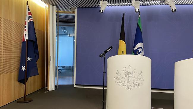 The Australian flag after being moved to the side of the room prior to the Greens leader conducting a press conference in Sydney on Monday