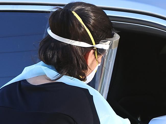 PERTH, AUSTRALIA - FEBRUARY 01: Members of the public attend the Rivervale drive thru Covid-19 testing clinic on February 01, 2021 in Perth, Australia. Lockdown restrictions are now in place across the Perth, Peel and South West regions of Western Australia following the discovery of a positive community COVID-19 case in a worker from a quarantine hotel facility.  As of 6pm on Sunday, people Perth, Peel and the South West are subject to stay at home orders, and will only be allowed to leave their homes to shop for essentials, for medical or health needs, exercise within their neighbourhood or travel to work if they cannot work from home. Face masks are now mandatory outdoors, with all restrictions to remain in place until 6pm on February 5. (Photo by Paul Kane/Getty Images)