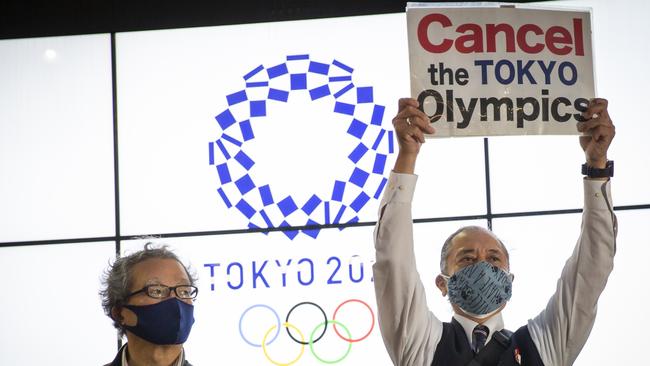 A protester holds a placard during a protest against the Tokyo Olympics this week in Tokyo, Japan. A recent survey has indicated that around 60 per cent of Japanese people do not want the Games to go ahead. Picture: Yuichi Yamazaki/Getty Images