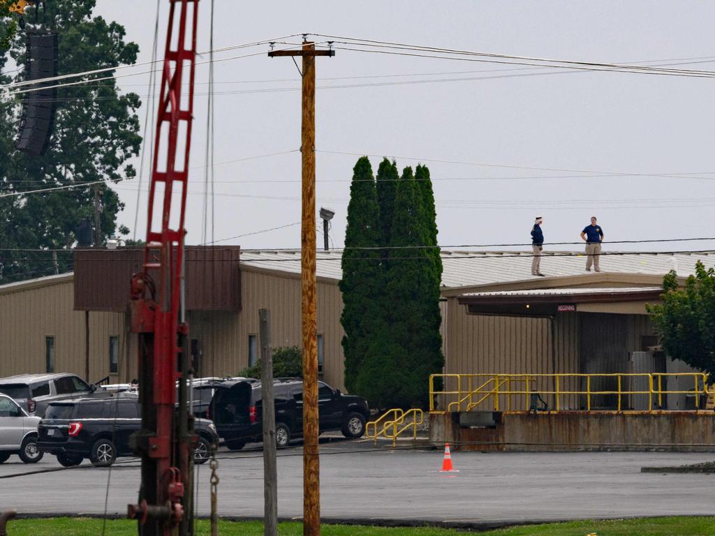 FBI investigators on the roof of AGR International. Picture: Jeff Swensen/Getty Images/AFP